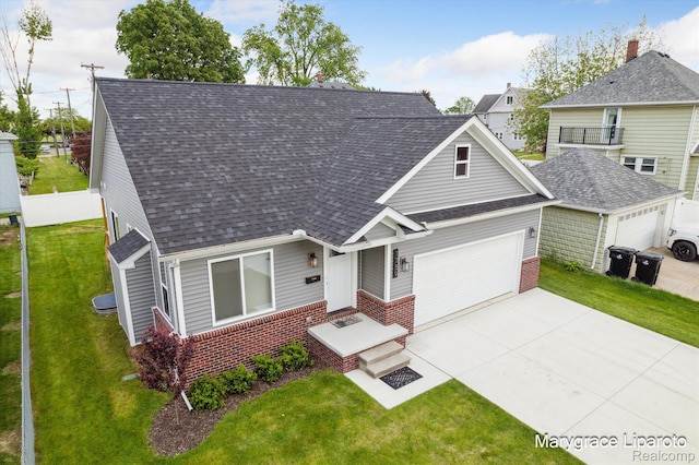 1759 2nd St, Taylor, MI 48192 - view of front of home featuring a garage, brick siding, a shingled roof, and concrete driveway