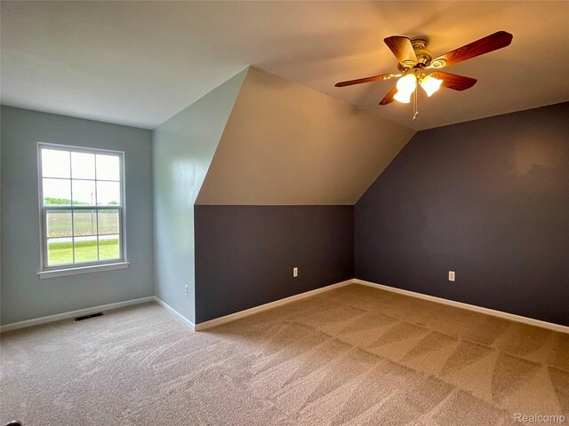 1325 Capac Rd, Berlin, MI 48002 - additional living space featuring carpet, a ceiling fan, baseboards, and vaulted ceiling