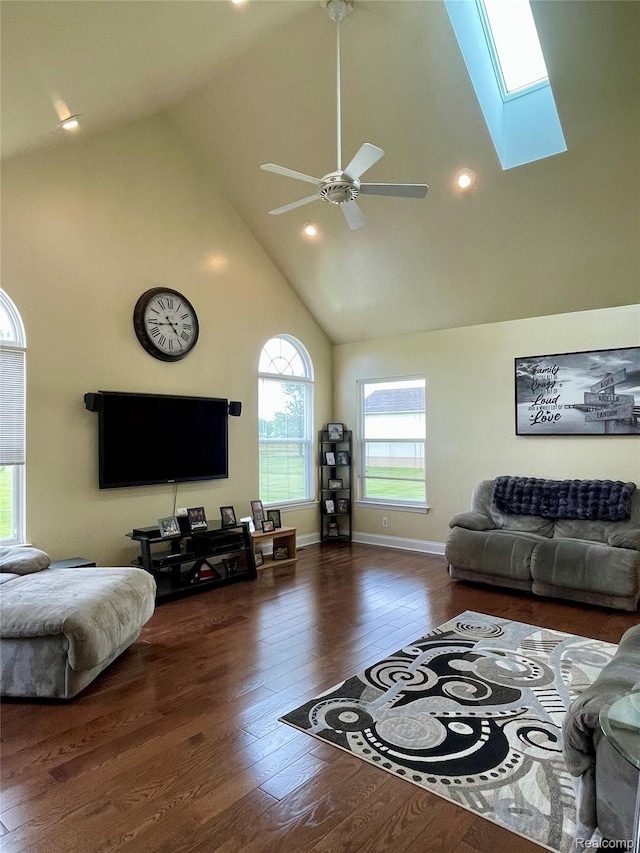 1325 Capac Rd, Berlin, MI 48002 - living area with high vaulted ceiling, a skylight, wood finished floors, a ceiling fan, and recessed lighting