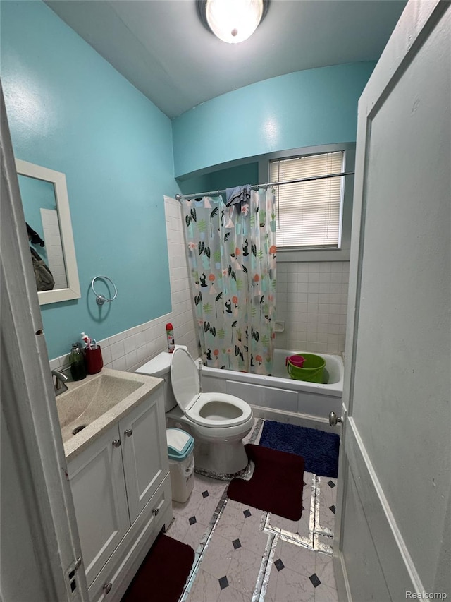 9633 Buffalo St, Hamtramck, MI 48212 - bathroom featuring toilet, vanity, shower / bath combo, tile patterned flooring, and inlaid floor details