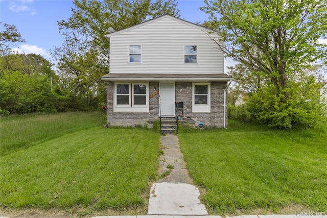 18625 Carrie St, Detroit, MI 48234 - view of front of home featuring a front lawn and brick siding
