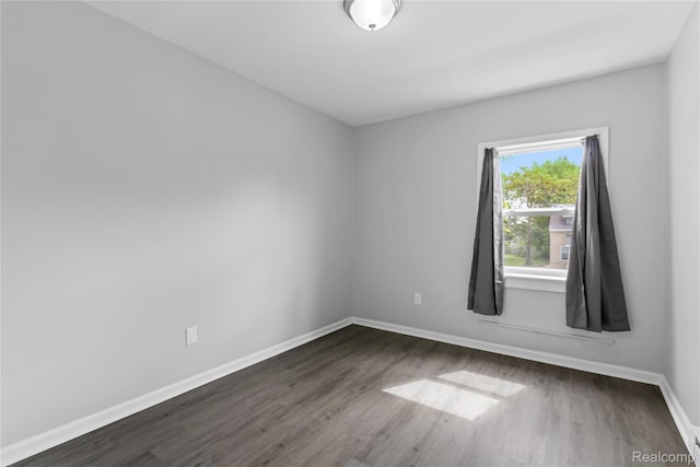 18625 Carrie St, Detroit, MI 48234 - unfurnished room with dark wood-type flooring and baseboards