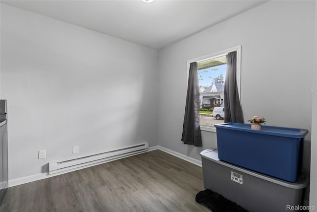 18625 Carrie St, Detroit, MI 48234 - unfurnished dining area with a baseboard heating unit, wood finished floors, and baseboards