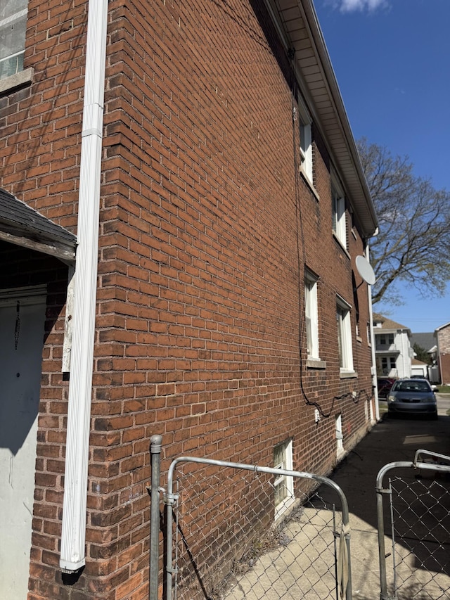 4649 Jonathon St, Dearborn, MI 48126 - view of property exterior with a gate and brick siding