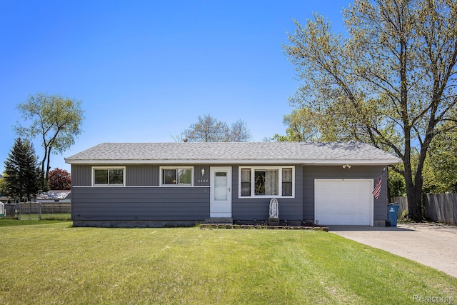 2263 Lawnel Ave, Norton Shores, MI 49441 - ranch-style home featuring an attached garage, driveway, and roof with shingles