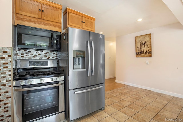 2263 Lawnel Ave, Norton Shores, MI 49441 - kitchen with stainless steel appliances, light tile patterned floors, baseboards, tasteful backsplash, and recessed lighting