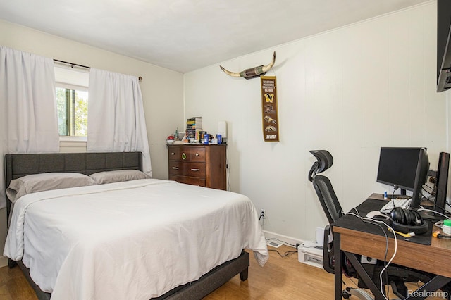2263 Lawnel Ave, Norton Shores, MI 49441 - bedroom featuring wood finished floors and a desk