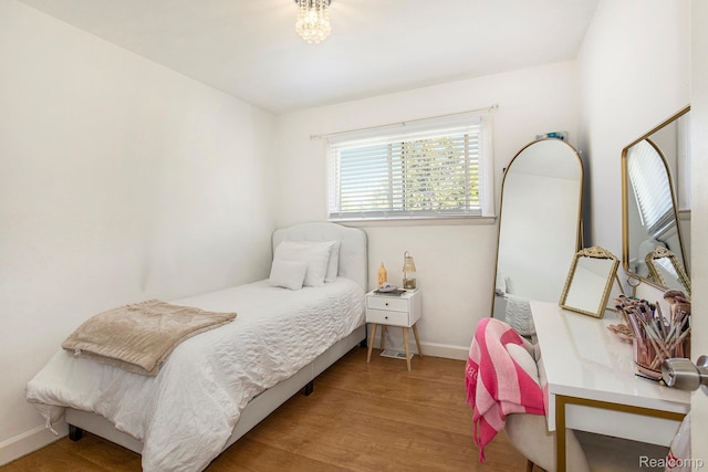 2263 Lawnel Ave, Norton Shores, MI 49441 - bedroom with wood finished floors and baseboards