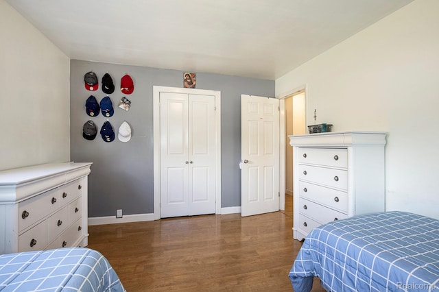 2263 Lawnel Ave, Norton Shores, MI 49441 - bedroom with wood finished floors, baseboards, and a closet