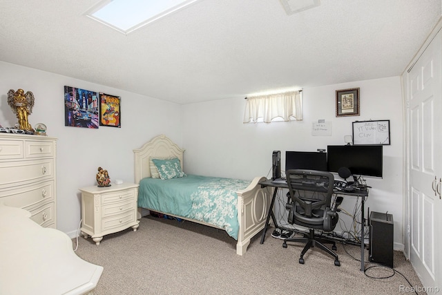 2263 Lawnel Ave, Norton Shores, MI 49441 - bedroom featuring light carpet, a textured ceiling, a desk, and baseboards