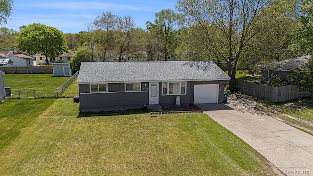 2263 Lawnel Ave, Norton Shores, MI 49441 - view of front facade featuring an attached garage, concrete driveway, and roof with shingles