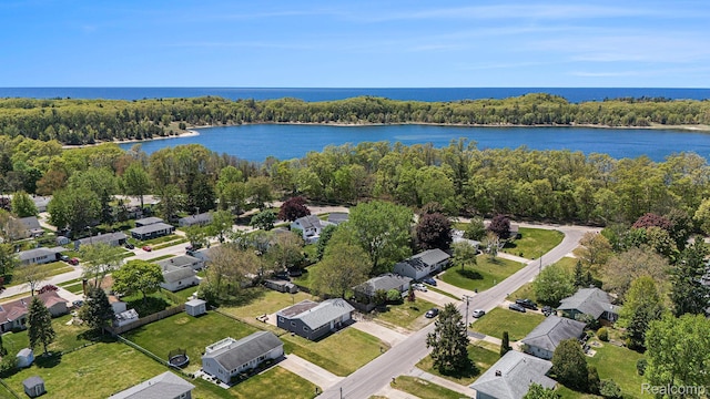 2263 Lawnel Ave, Norton Shores, MI 49441 - aerial perspective of suburban area featuring a large body of water and a heavily wooded area