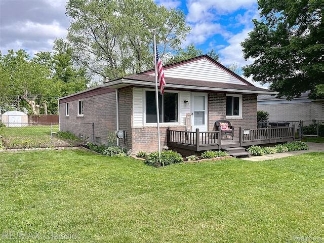 18316 Floral St, Livonia, MI 48152 - view of front facade with brick siding, a deck, and a storage unit