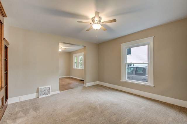 1118 Burr St, Jackson, MI 49201 - carpeted empty room featuring ceiling fan and baseboards