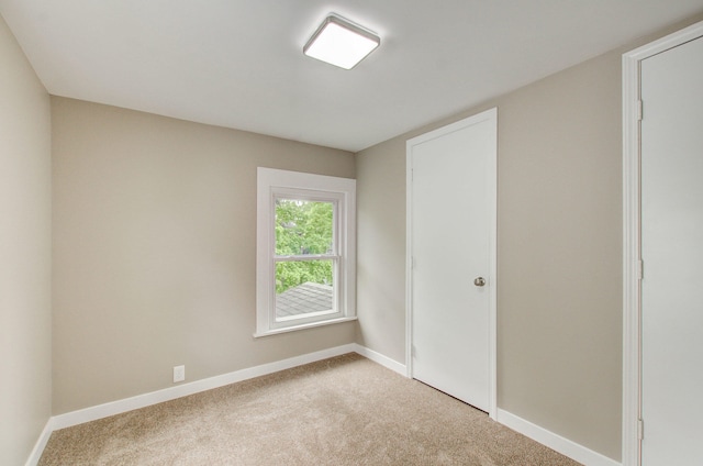 1118 Burr St, Jackson, MI 49201 - carpeted spare room with baseboards