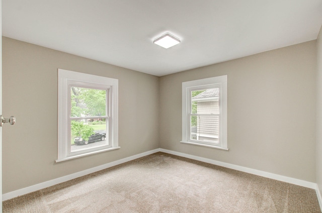 1118 Burr St, Jackson, MI 49201 - unfurnished room with carpet floors and baseboards