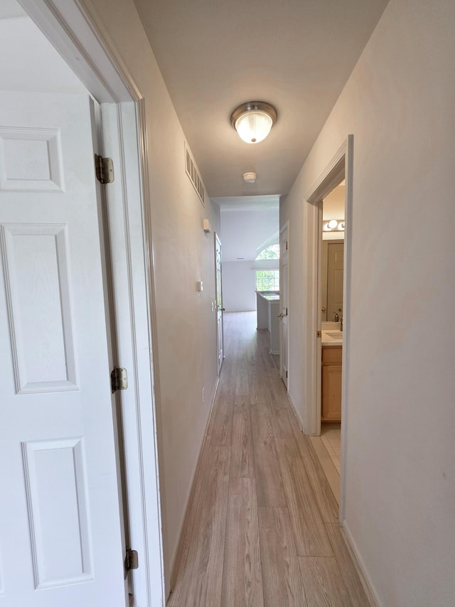 2936 Signature Blvd, Ann Arbor, MI 48103 - hall with light wood-style floors, a sink, and baseboards