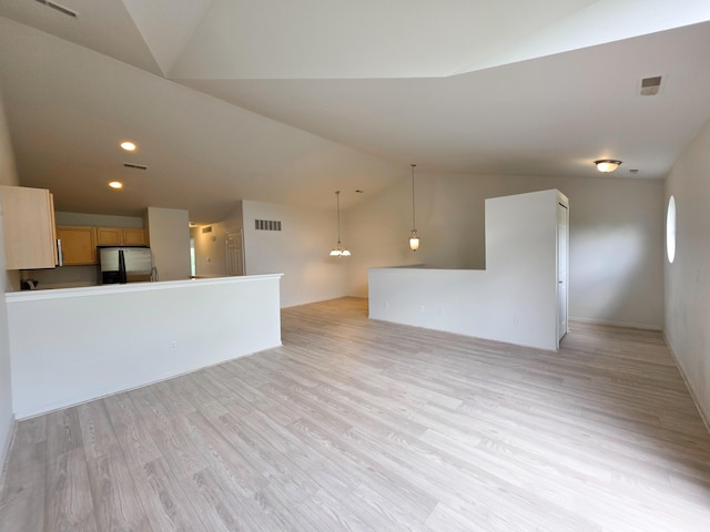 2936 Signature Blvd, Ann Arbor, MI 48103 - unfurnished living room featuring lofted ceiling, light wood finished floors, and recessed lighting