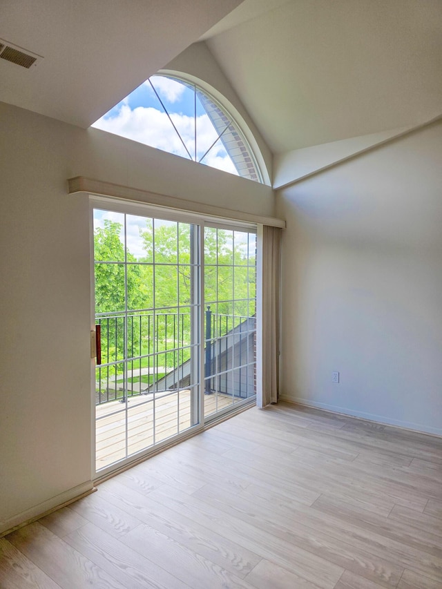 2936 Signature Blvd, Ann Arbor, MI 48103 - unfurnished room with light wood-style floors, baseboards, and high vaulted ceiling