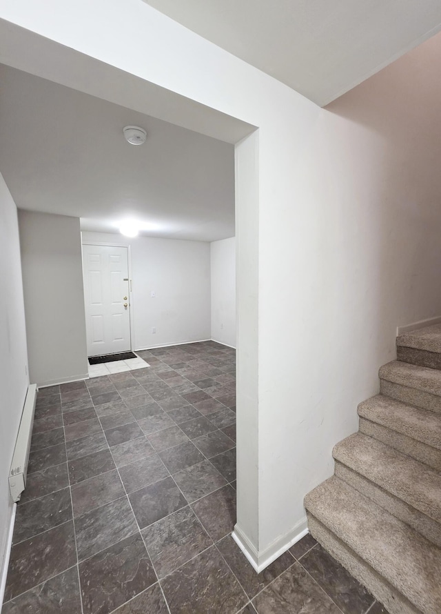 2936 Signature Blvd, Ann Arbor, MI 48103 - finished below grade area with stairway, baseboard heating, and baseboards