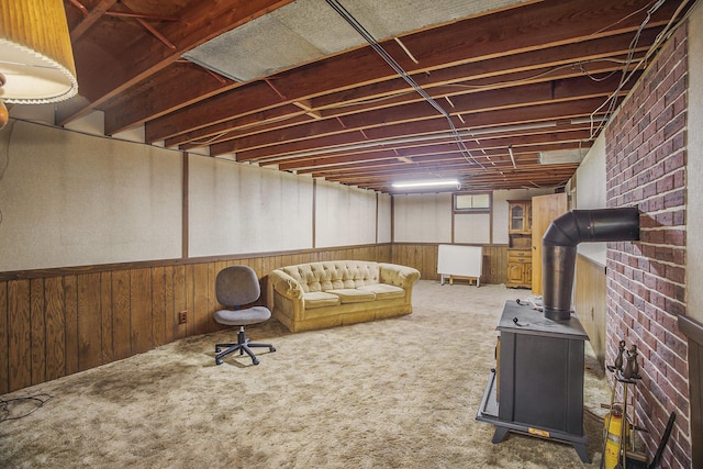 15035 155th Ave, Grand Haven, MI 49417 - finished below grade area with a wood stove, wood walls, and carpet flooring