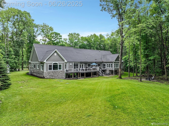 800 Greystone Dr, Chelsea, MI 48118 - back of house featuring a deck, stone siding, a lawn, and stairway