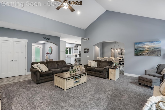 800 Greystone Dr, Chelsea, MI 48118 - living area with arched walkways, a ceiling fan, and high vaulted ceiling