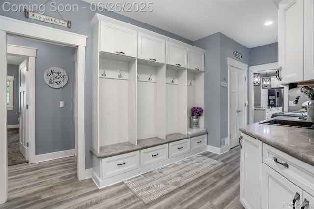 800 Greystone Dr, Chelsea, MI 48118 - mudroom with wood finished floors and recessed lighting