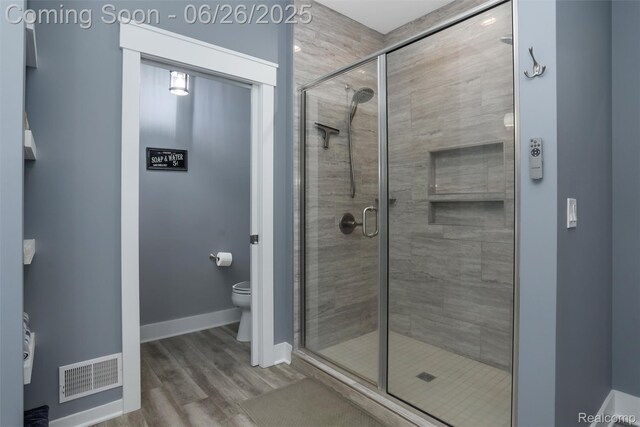 800 Greystone Dr, Chelsea, MI 48118 - full bath featuring a shower stall and wood finished floors