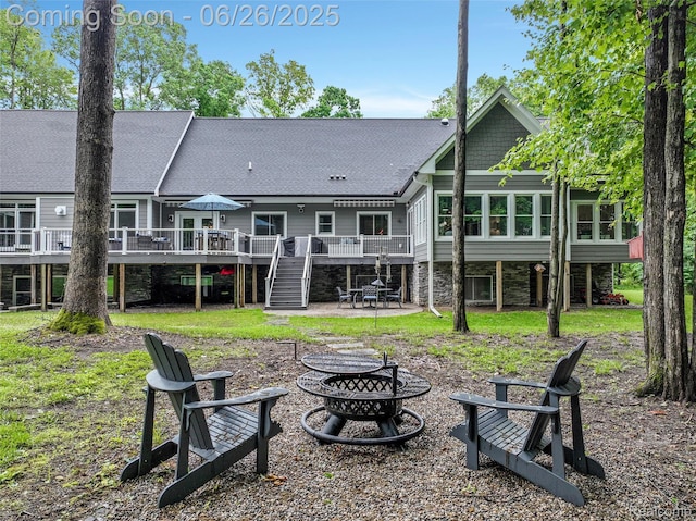 800 Greystone Dr, Chelsea, MI 48118 - rear view of house with a fire pit, stairway, a deck, a patio, and roof with shingles
