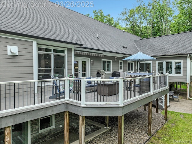 800 Greystone Dr, Chelsea, MI 48118 - back of property featuring roof with shingles, a wooden deck, outdoor dining space, and french doors