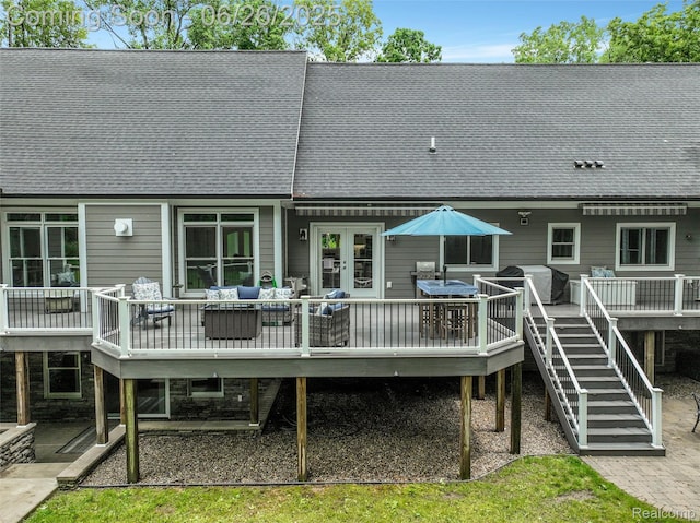 800 Greystone Dr, Chelsea, MI 48118 - back of house featuring a deck, roof with shingles, an outdoor living space, and outdoor dining space