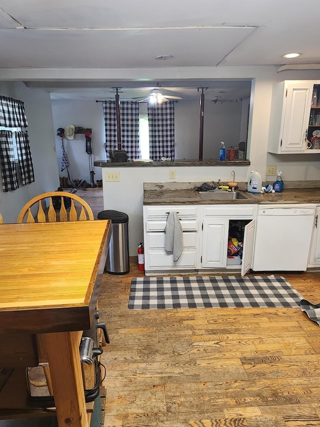 19354 Dutch Settlement St, Cassopolis, MI 49031 - kitchen with dishwasher, a sink, wood finished floors, white cabinets, and recessed lighting