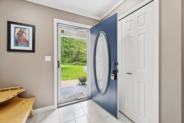 16350 Whitaker Rd, Linden, MI 48451 - entryway featuring baseboards, light tile patterned flooring, and ornamental molding