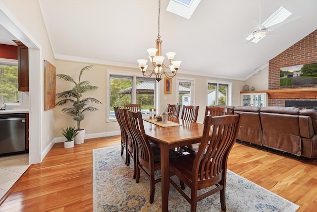 16350 Whitaker Rd, Linden, MI 48451 - dining area with a skylight, healthy amount of natural light, a chandelier, lofted ceiling, and light wood-type flooring
