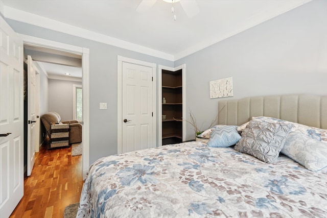 16350 Whitaker Rd, Linden, MI 48451 - bedroom featuring wood finished floors, ornamental molding, and a ceiling fan