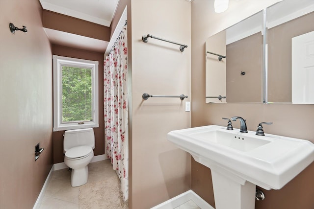 16350 Whitaker Rd, Linden, MI 48451 - full bathroom with baseboards, toilet, a sink, a shower with shower curtain, and tile patterned floors