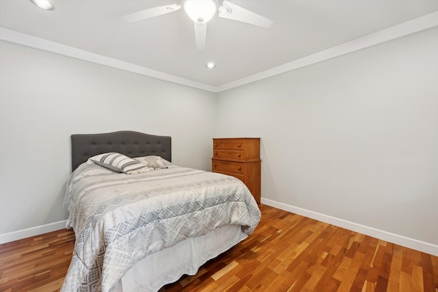 16350 Whitaker Rd, Linden, MI 48451 - bedroom with baseboards, wood finished floors, a ceiling fan, recessed lighting, and crown molding
