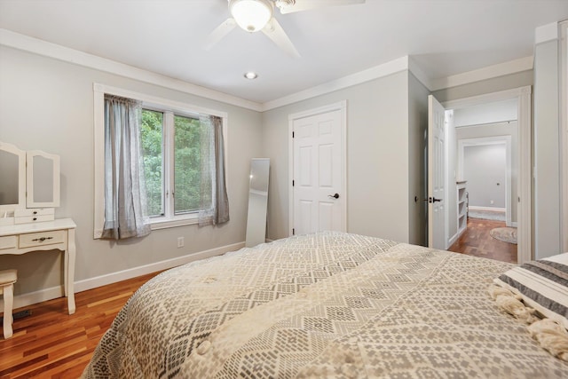 16350 Whitaker Rd, Linden, MI 48451 - bedroom with wood finished floors, baseboards, ornamental molding, and a ceiling fan