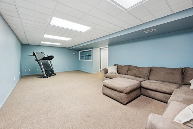 16350 Whitaker Rd, Linden, MI 48451 - living area with light colored carpet, baseboards, and a paneled ceiling