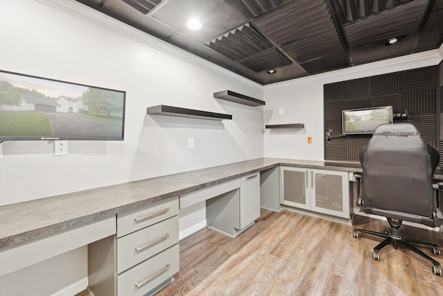 16350 Whitaker Rd, Linden, MI 48451 - office space with built in study area, crown molding, and light wood finished floors