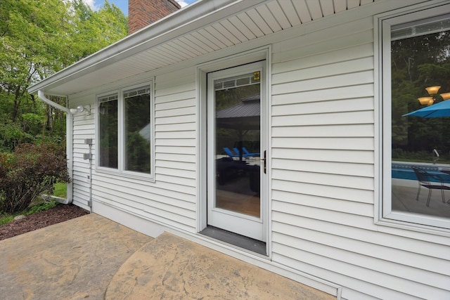 16350 Whitaker Rd, Linden, MI 48451 - entrance to property featuring a patio and a chimney