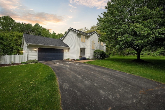 16350 Whitaker Rd, Linden, MI 48451 - view of front facade featuring an attached garage and asphalt driveway