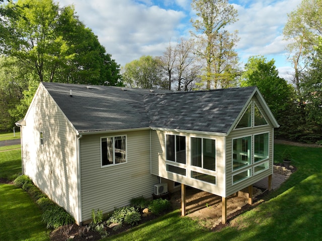 11775 Crystal Ridge Dr NE, Sparta, MI 49345 - back of property featuring roof with shingles and a yard