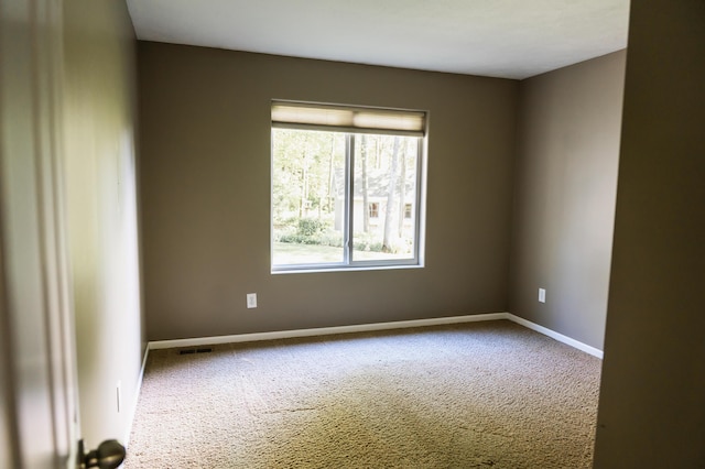 11775 Crystal Ridge Dr NE, Sparta, MI 49345 - empty room with carpet and baseboards