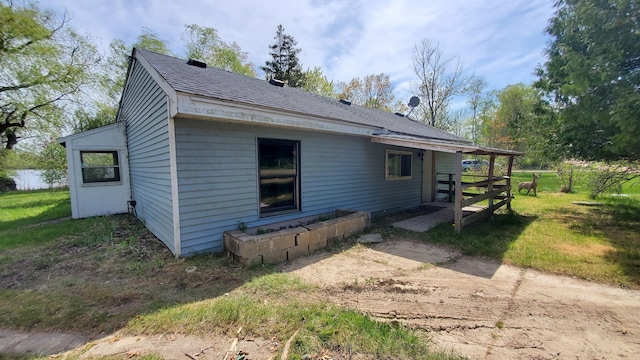 599 Ruby Rd, Sheridan, MI 48884 - view of property exterior with a shingled roof
