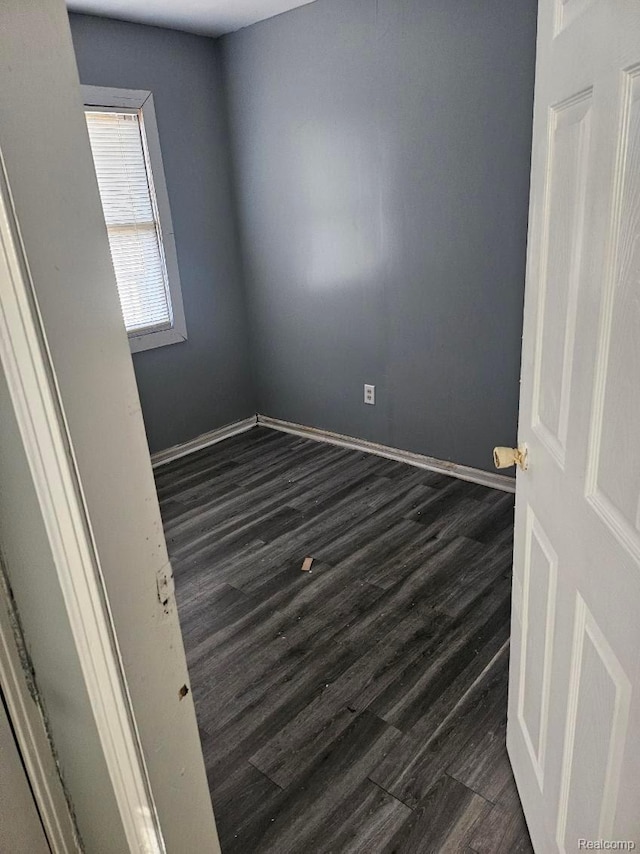 28632 Hazelwood St, Detroit, MI 48141 - unfurnished room featuring dark wood-type flooring and baseboards
