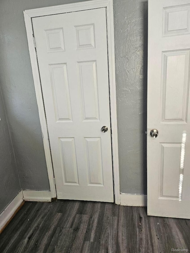 28632 Hazelwood St, Detroit, MI 48141 - detailed view of wood finished floors, baseboards, and a textured wall