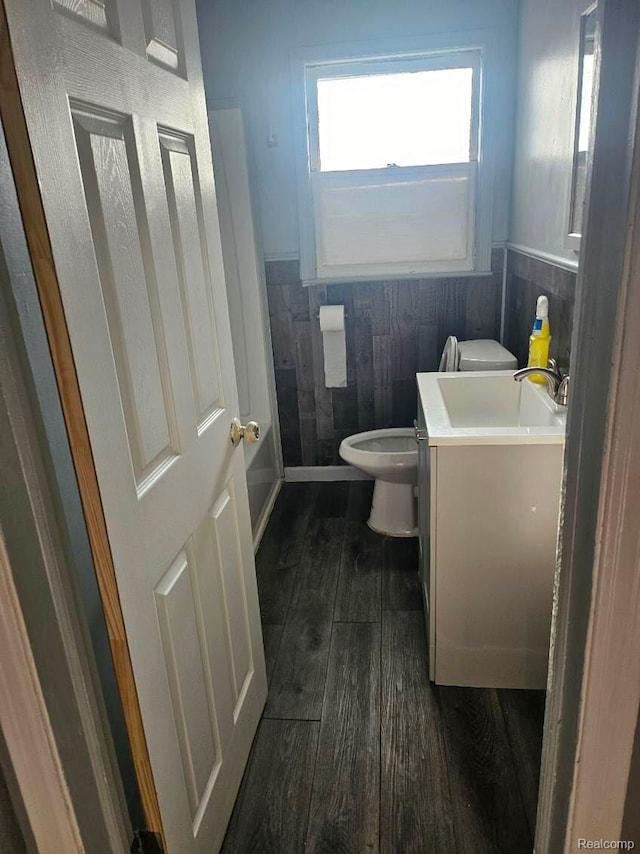 28632 Hazelwood St, Detroit, MI 48141 - bathroom with wood finished floors, vanity, toilet, and wainscoting