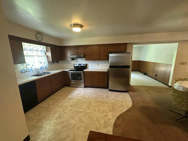 388 Richard St, Spring Arbor, MI 49283 - kitchen with stainless steel appliances, a sink, under cabinet range hood, light countertops, and dark brown cabinetry